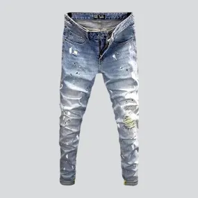 Ripped light men's wash jeans